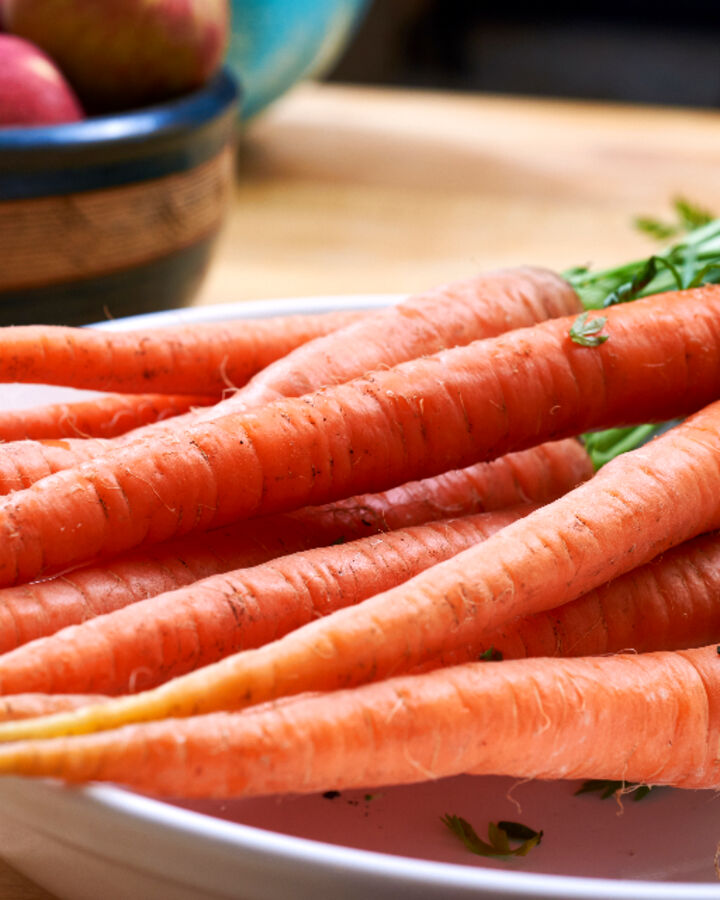 Fresh carrots on a kitchen counter