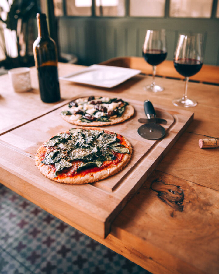 Homemade pizzas on a wooden board